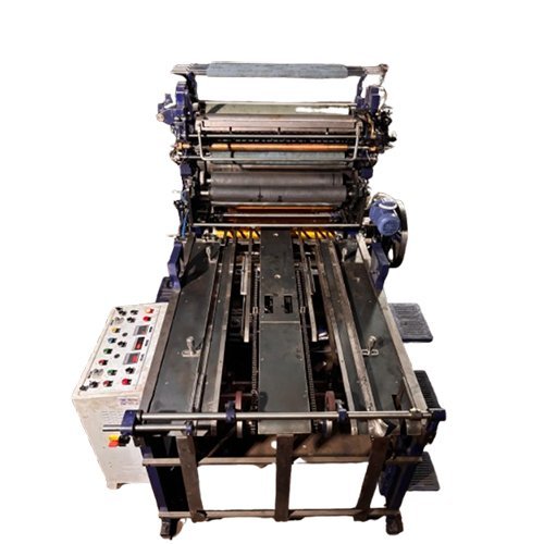Offset printing machine viewed from above, showing the feed board and control panel